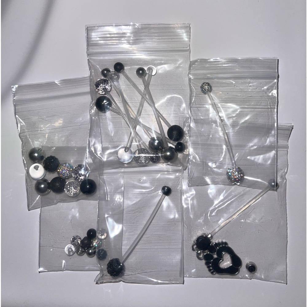 Brand new, never been worn maternity belly button rings!